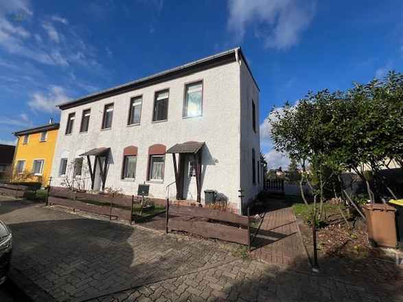 Teilvermietetes 3-Parteienhaus mit zusätzlichem Bauland