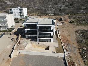 Thumbnail von Modernes Neubau-Appartement mit wunderschönem Meerblick, Garten und privatem Pool