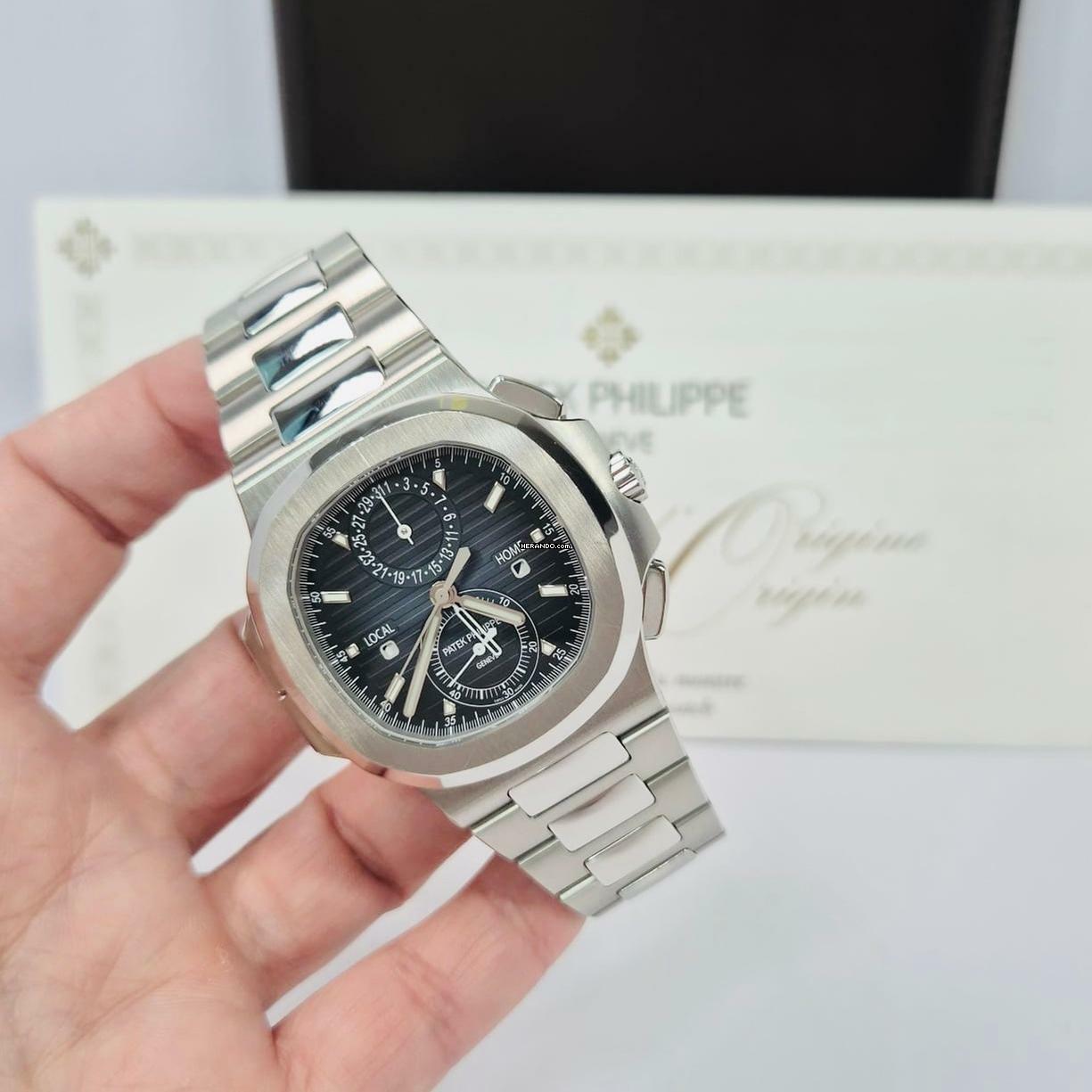 Patek Philippe Nautilus Travel Time Flyback Blue Dial 40.5mm Automático Completo